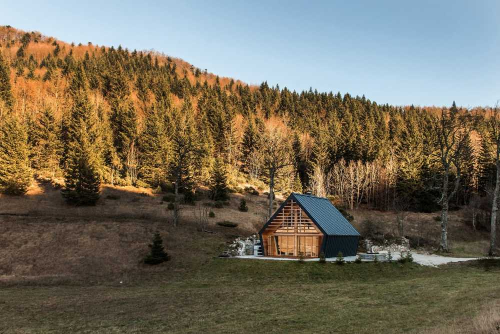 Wooden house with traditional shapes in nature