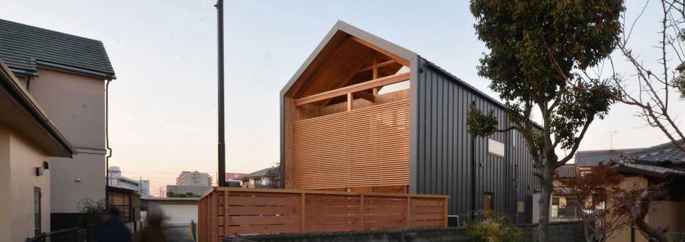 Wooden house covered with metal